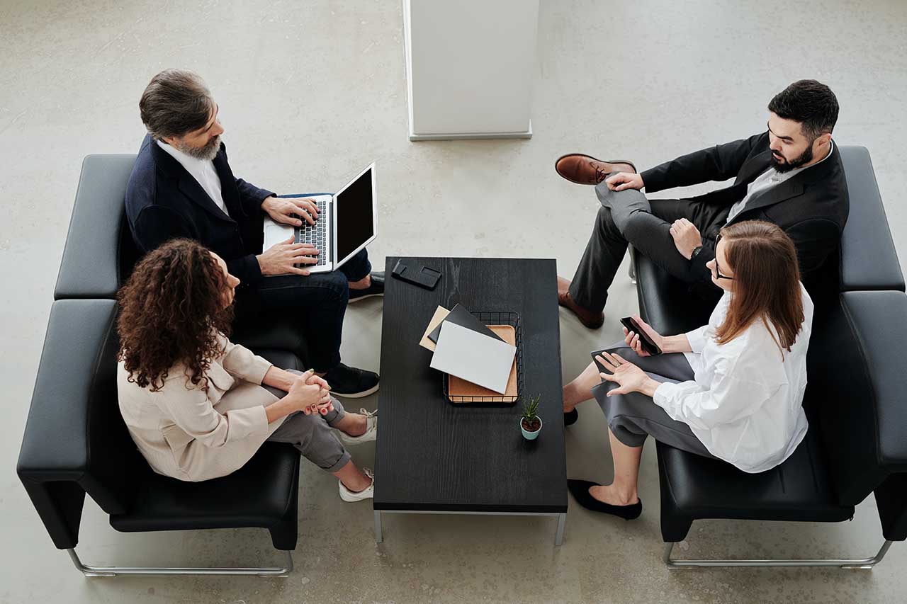 Office workers relaxing in lobby